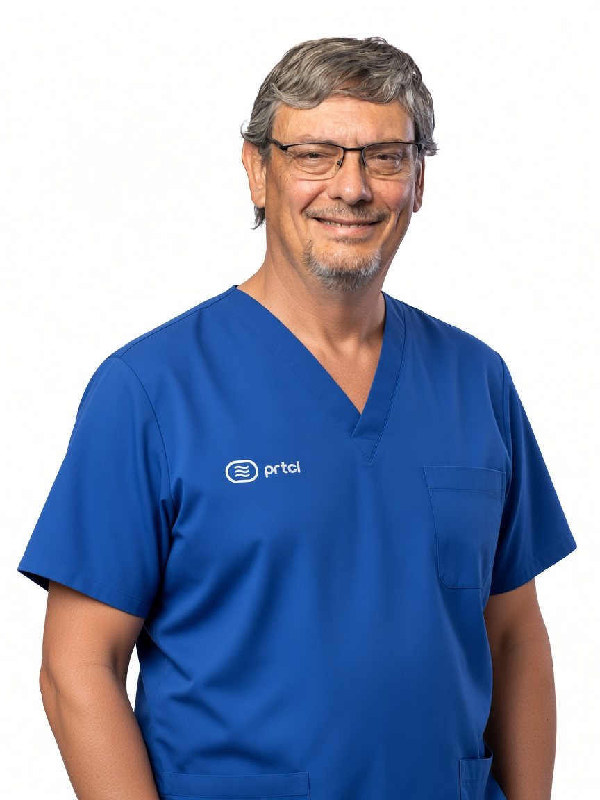 Dr. B. Monte Stewart, MD, FACS, Medical Director, in blue Health PRTCL scrubs